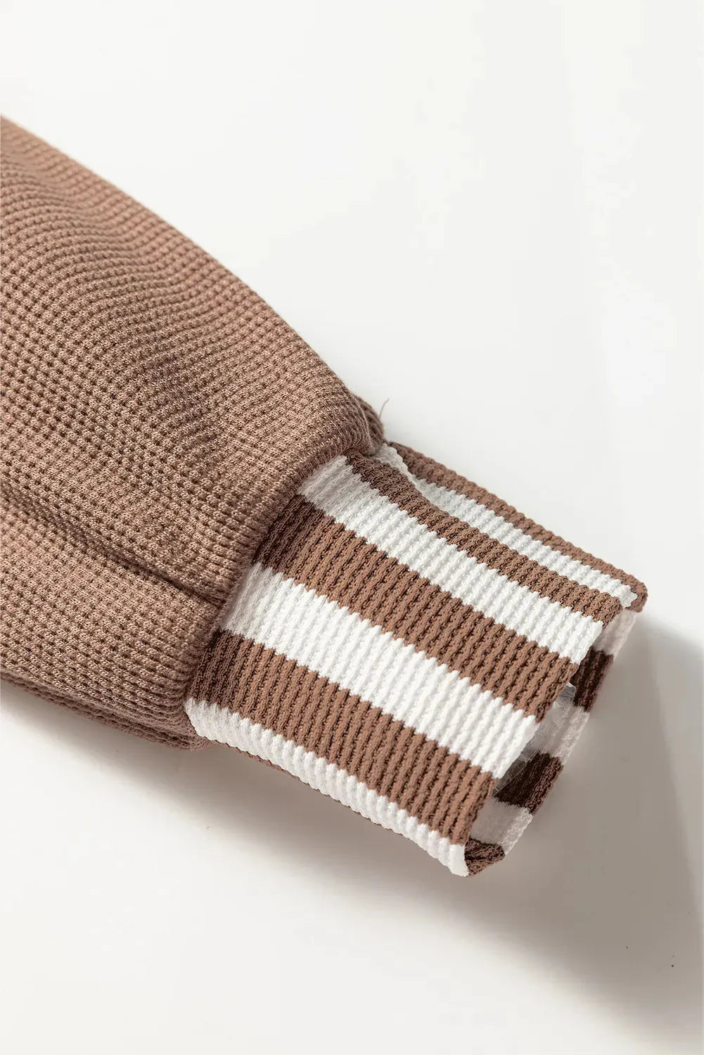 Straw yellow women's hoodie with waffle texture and striped patchwork design, featuring a button neck and drawstring waist.