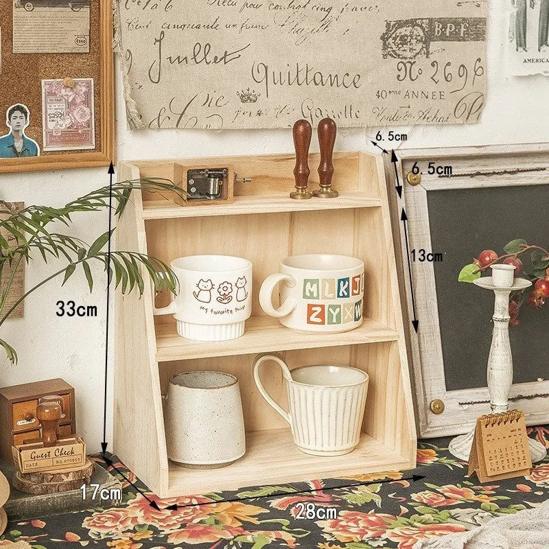 Solid wood multi-layer cup storage box in blue finish, showing two tiers of cups organised neatly on a kitchen counter.