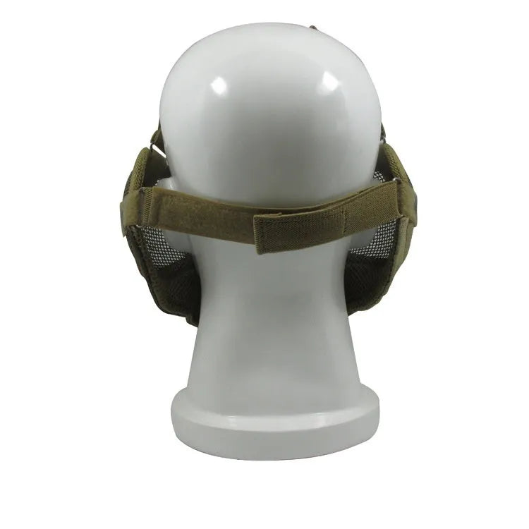 Carbon steel field protective mask with head mount in camouflage pattern, shown with attached mouth muffler.
