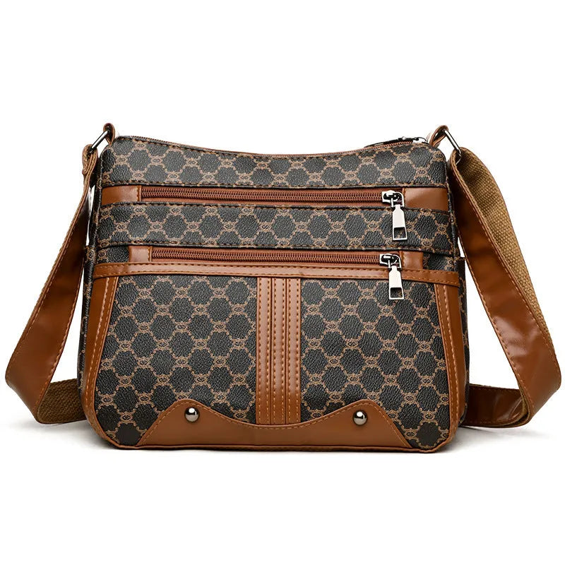 Women's brown and white stitching pattern large-capacity crossbody bag with PU exterior.