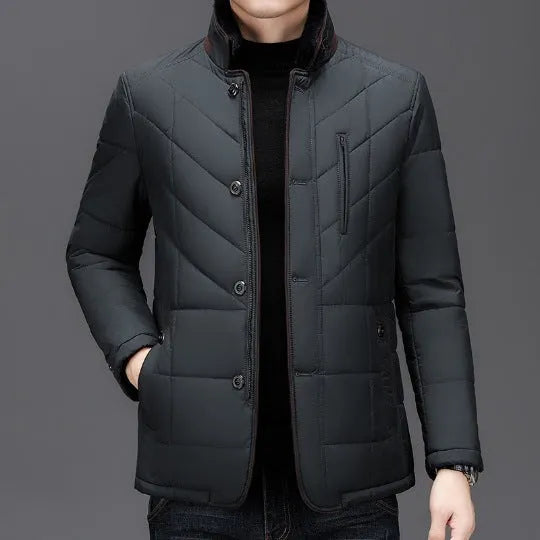 Men's dark blue padded winter short coat with side pockets on a neutral background.