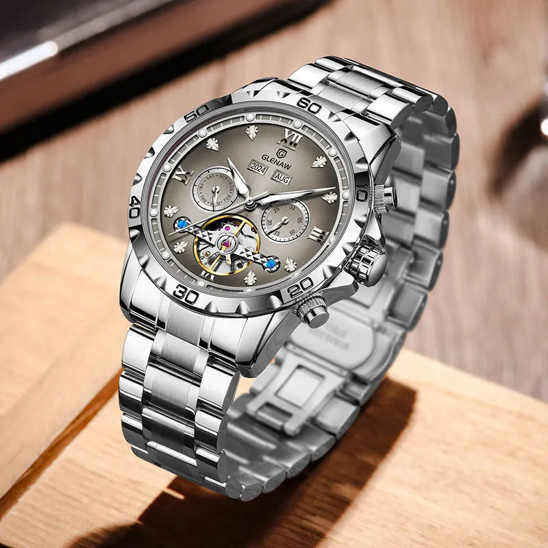 Men's automatic mechanical watch with stainless steel strap on a wrist, showing a grey dial and silver case option.