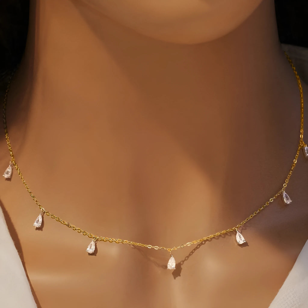 Women's silver drop-shaped artificial zircon necklace on an O-shaped chain, shown in rose gold, golden yellow and silver finishes.