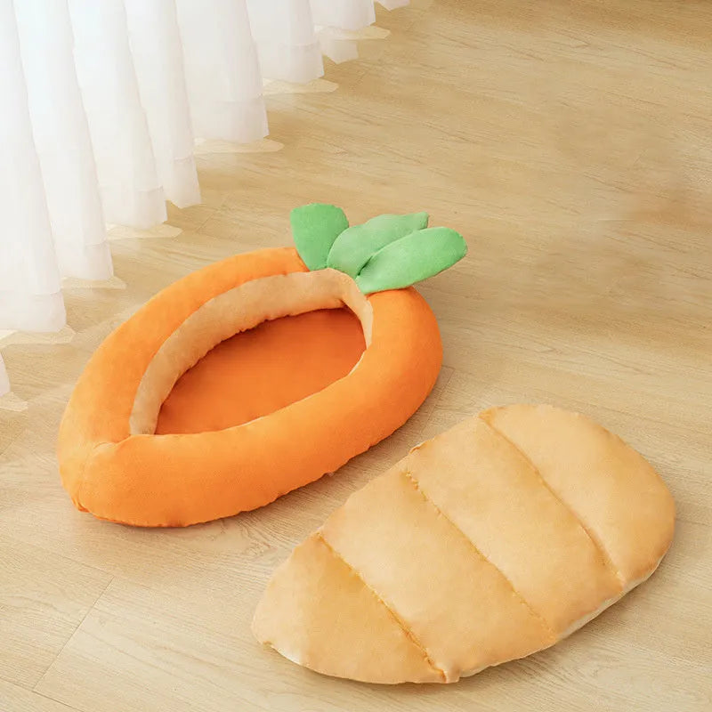 Orange carrot-shaped dog nesting bed with a raised bolster edge and a separate soft blanket, shown in two sizes.