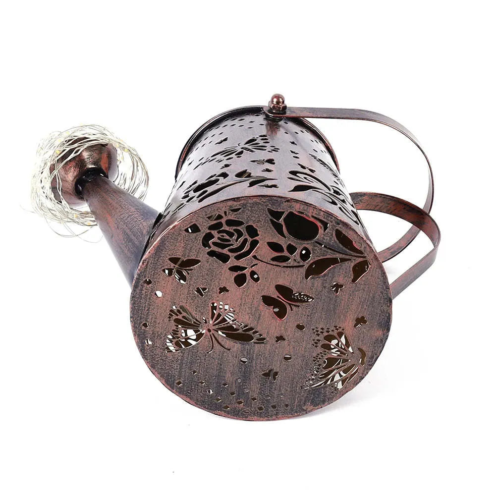 Solar garden lamp with a tapered butterfly pattern iron shade.