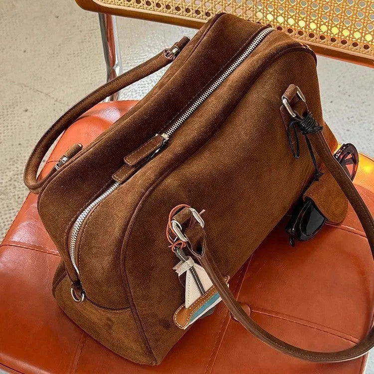 Brown suede large capacity underarm pillow bag with horizontal square shape and zipper closure