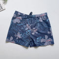 Men's loose fit anti-embarrassment swimming trunks in dark blue background large flower pattern, polyester fabric