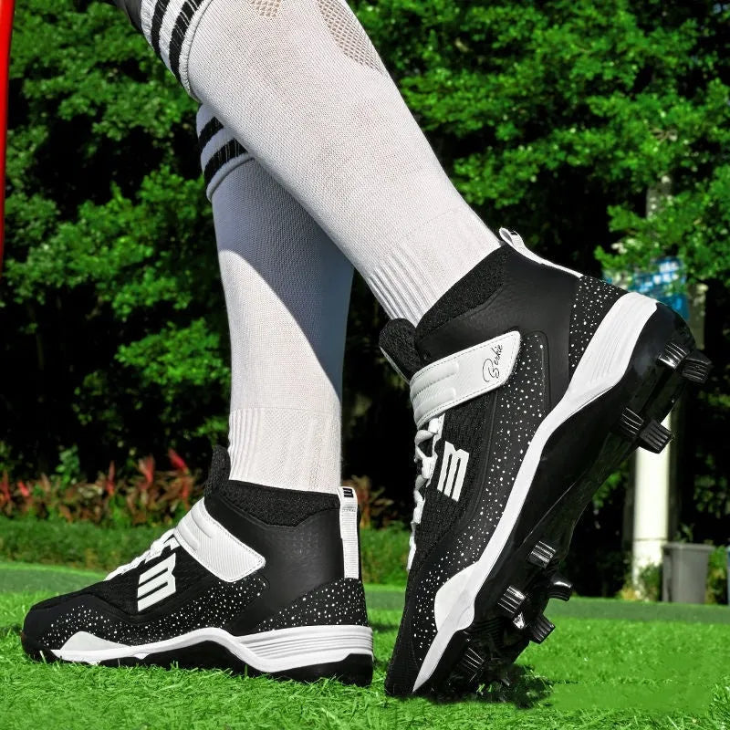 Black and white youth baseball training sneakers with a Velcro strap and textured rubber sole.