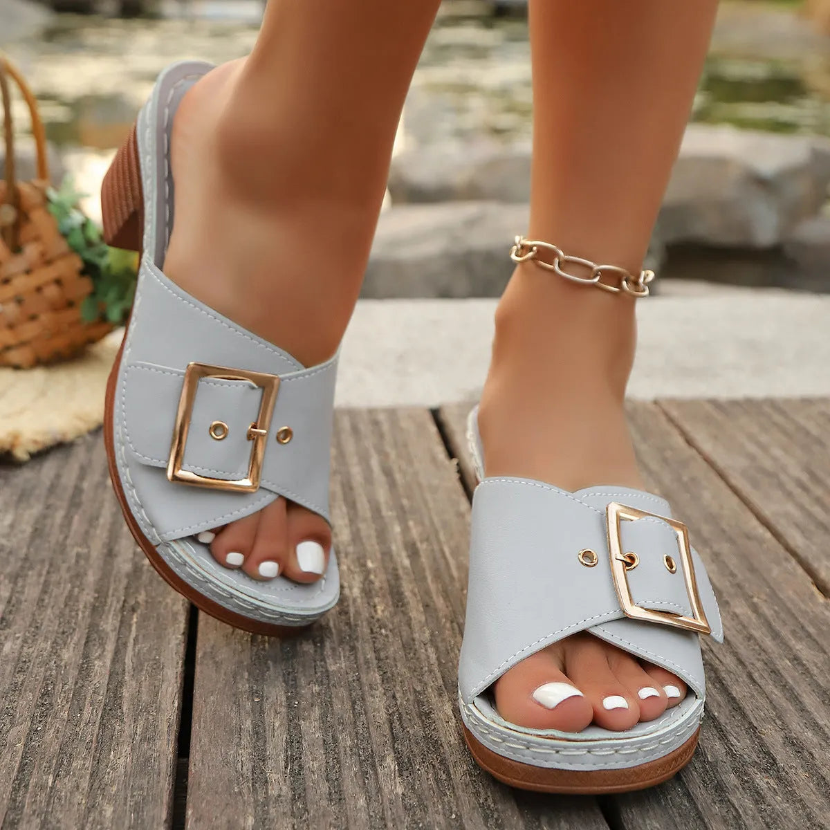Women's black retro chunky heel sandals with a round toe and silver metal buckle on a rubber sole.
