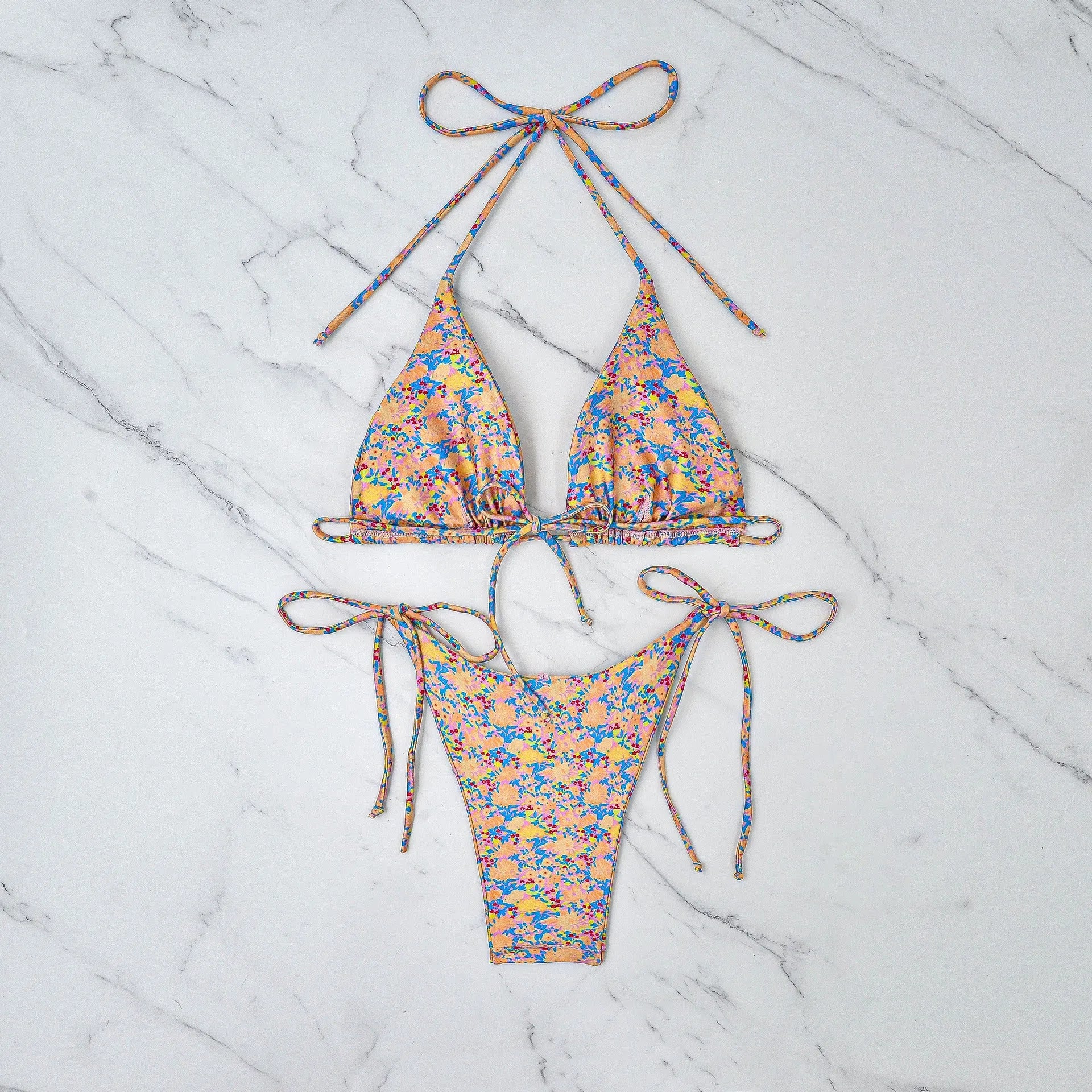 Women's lace-up bikini set in polyester for swimming, showing backless design.