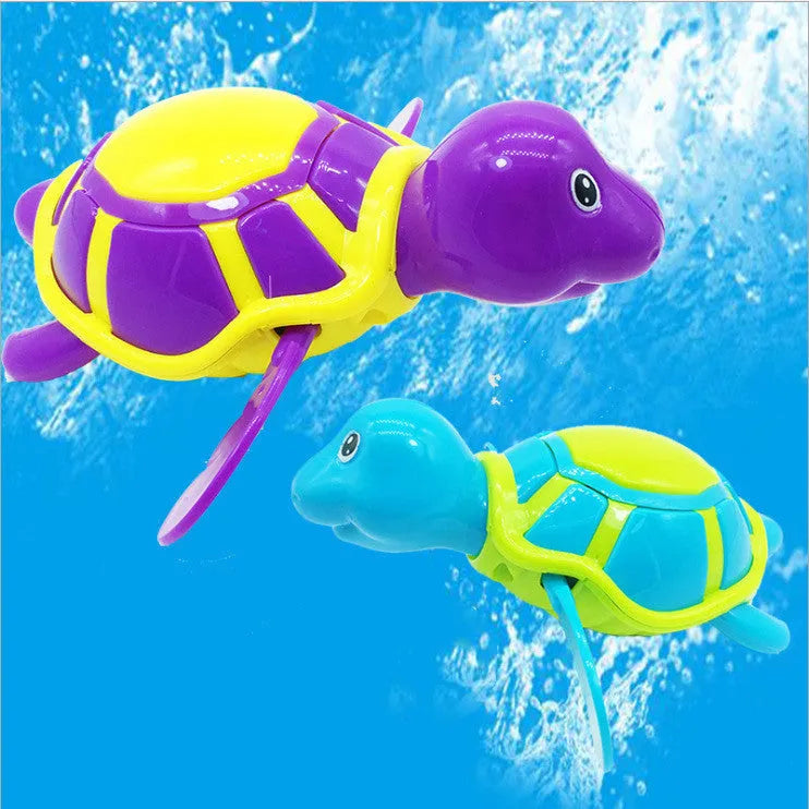 Plastic baby tortoise bath toy floating in water for infant bath time play