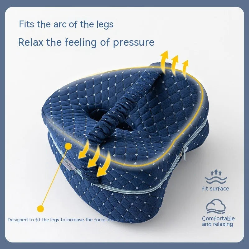 Love heart shaped memory foam leg pillow in dark blue jacquard fabric, shown next to a tape measure indicating 25x23x13 cm dimensions.