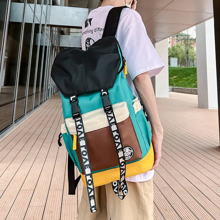 A black Oxford cloth backpack showing its size, carried over one shoulder.