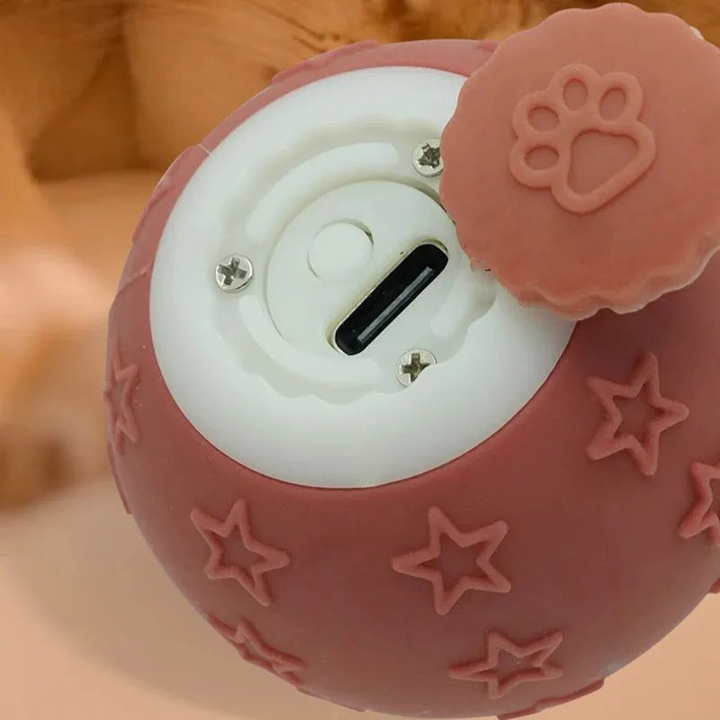 Blue smart ball cat toy with rechargeable feature and rolling motion on a floor