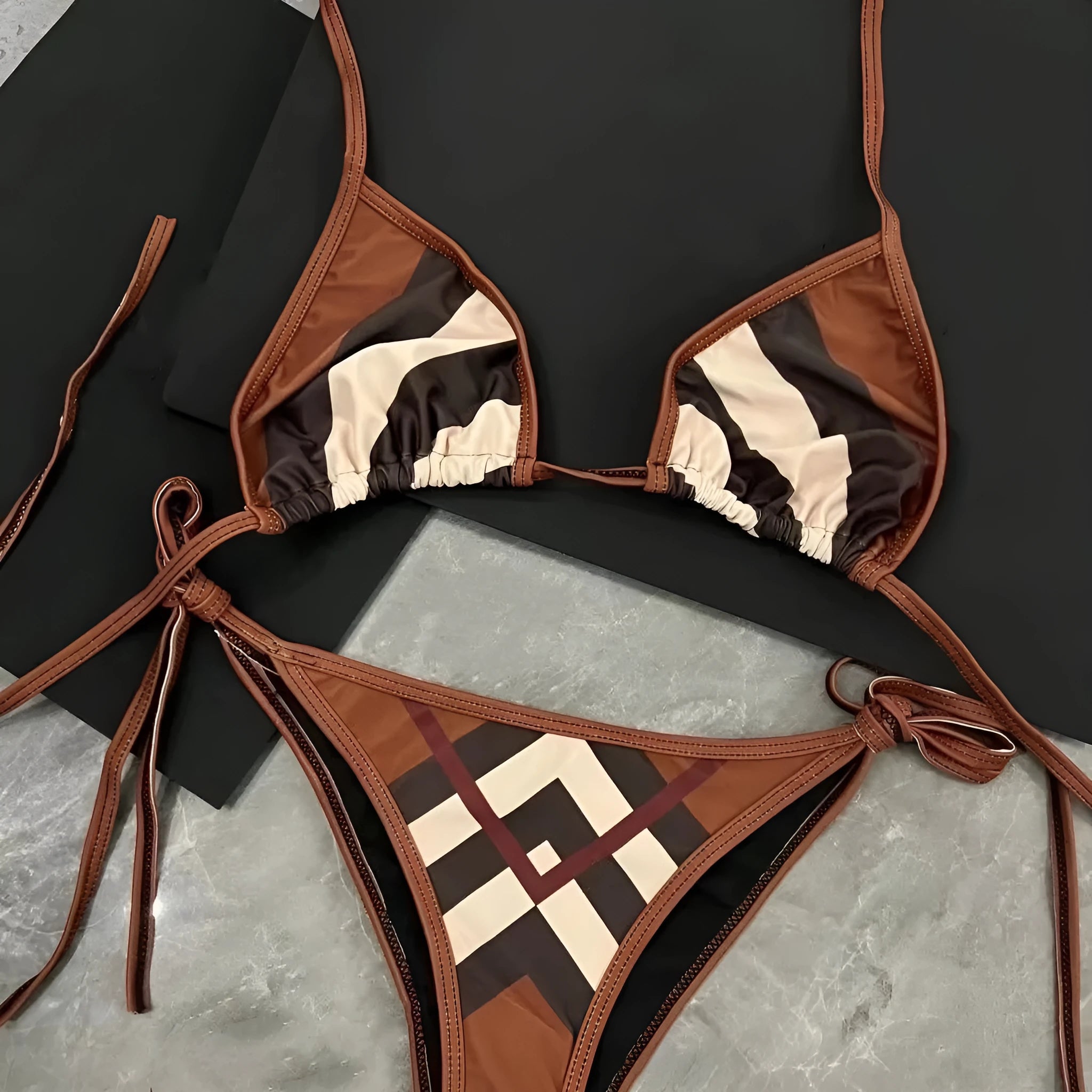 Women's black and white floral bikini set with briefs style bottoms in polyester for summer swimming