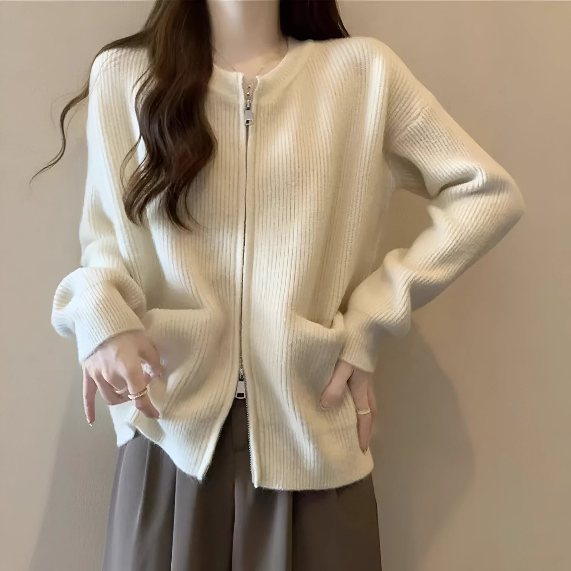 Beige viscose fibre long sleeve sweater coat cardigan laid flat.