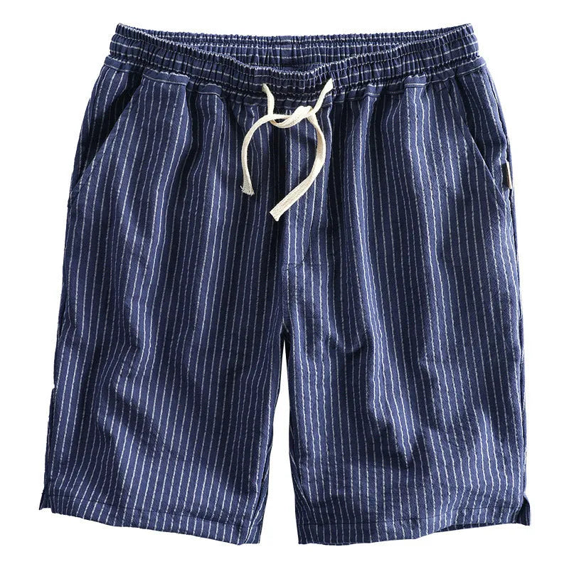 Men's striped casual loose shorts in light blue colour on a mid waist, showing the straight leg shorts cut.