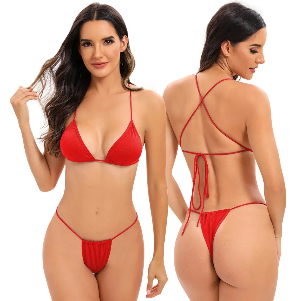 Women's candy coloured cross strap bikini swimsuit on a hanger, showing striped pattern and optional chest pad.