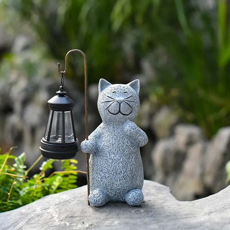 Resin cat lift solar garden lamp with pastoral design and integrated solar panel