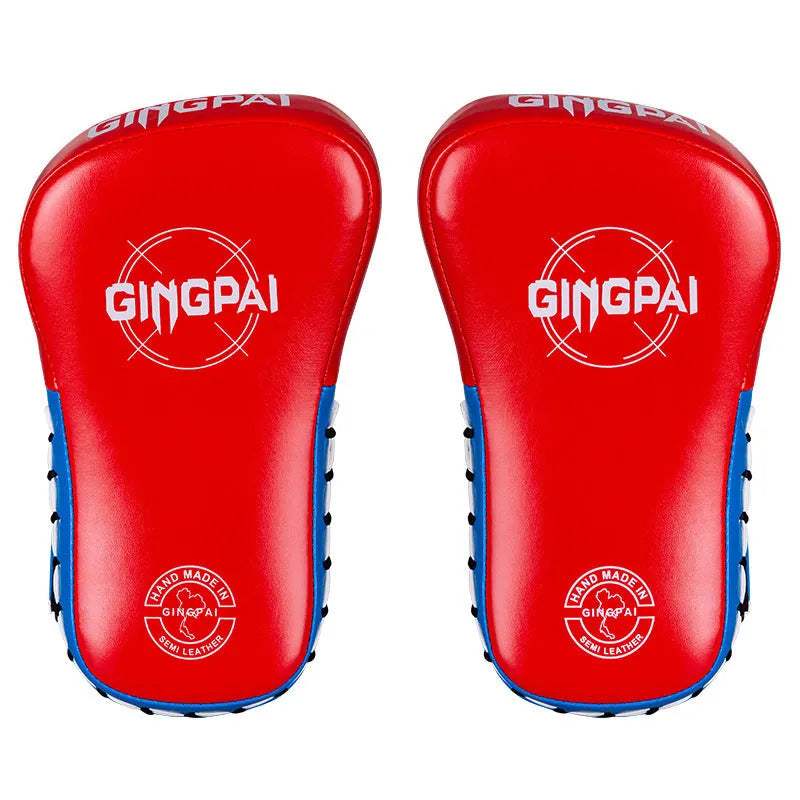 A pair of children's hanging boxing leg target pads in red PU foam for martial arts training.