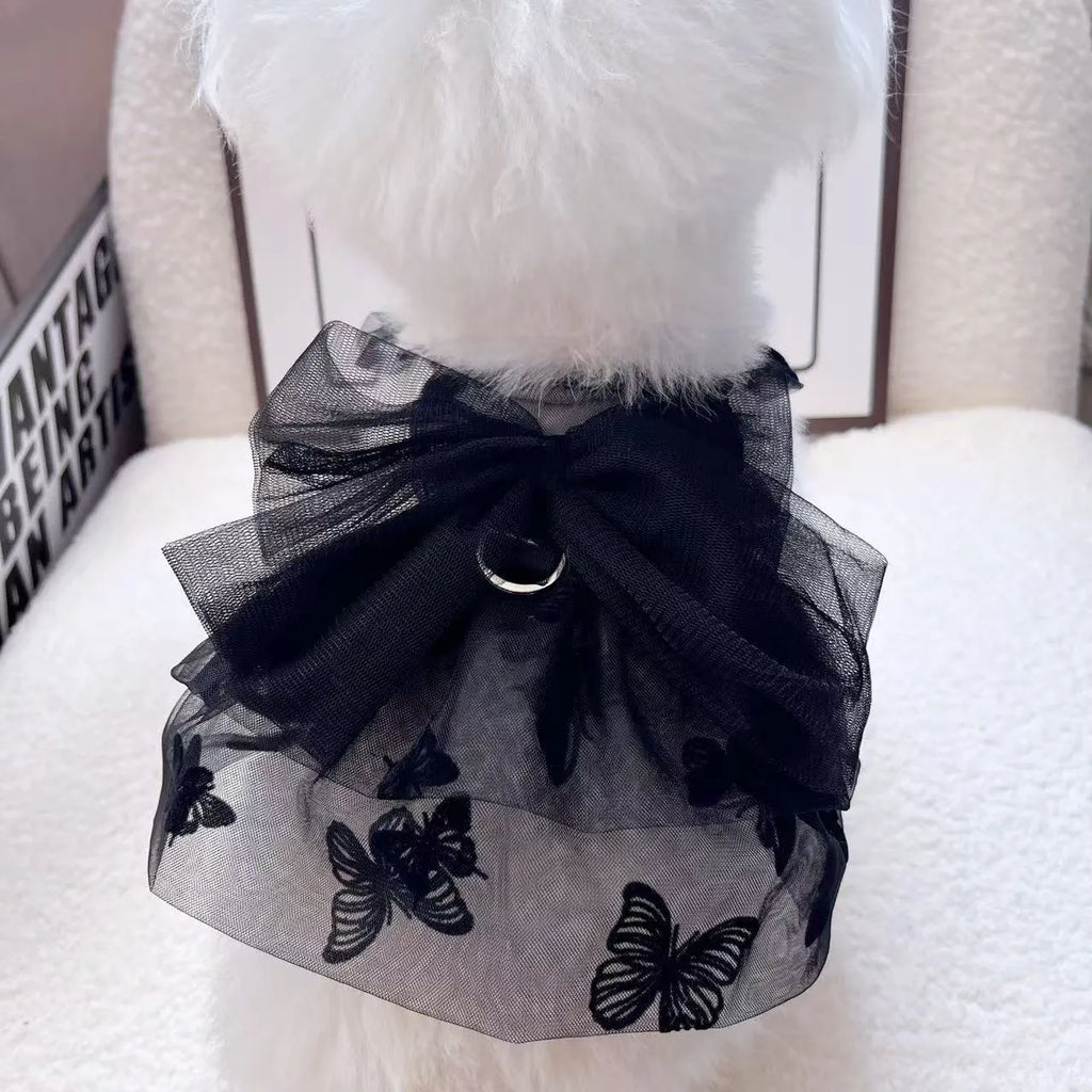 Black layered tulle princess skirt on a small dog, showing elastic waistband and tiered design.
