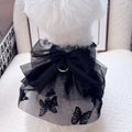 Black layered tulle princess skirt on a small dog, showing elastic waistband and tiered design.