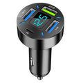 Black four-port USB car charger with LED digital display showing voltage.