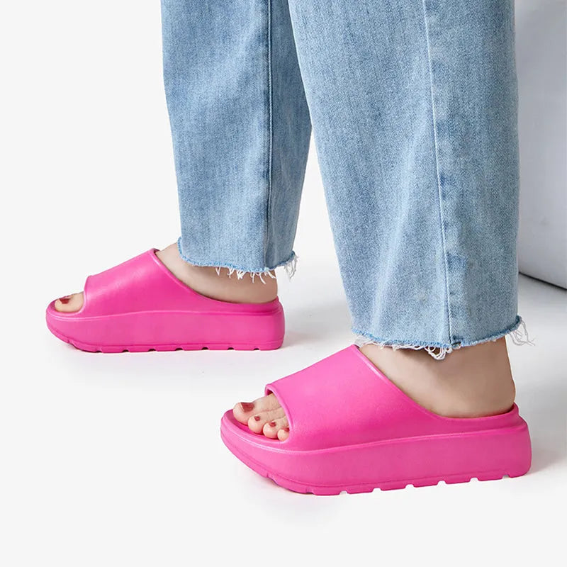 Women's beige fish mouth slippers with a thick 5.5cm EVA sole on a tiled floor.