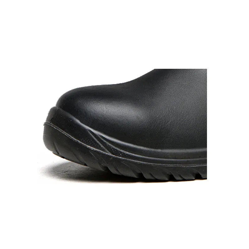 Black leather high-top safety work boots with anti-piercing sole on a work site background.
