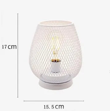 Retro iron art battery powered birdcage table lamp with warm light on bedside table