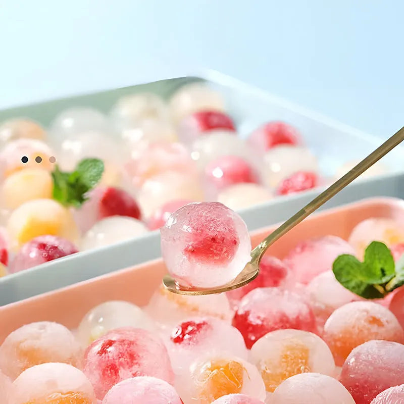 Blue 33-grid round silicone ice cube tray with transparent lid next to pink version, showing dimensions.