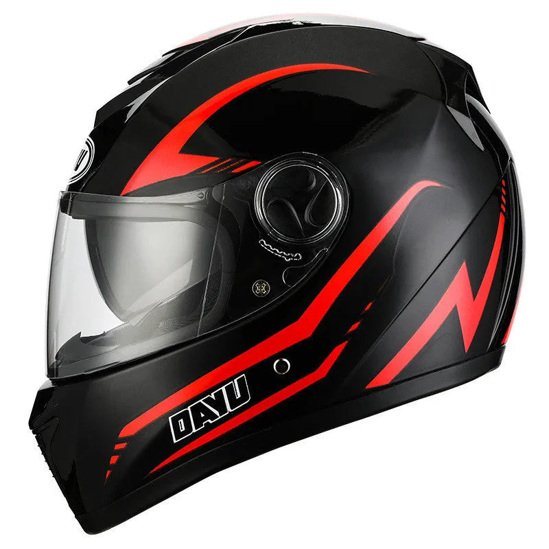 Black and red patterned motorcycle helmet with a double-lens visor on a neutral background.