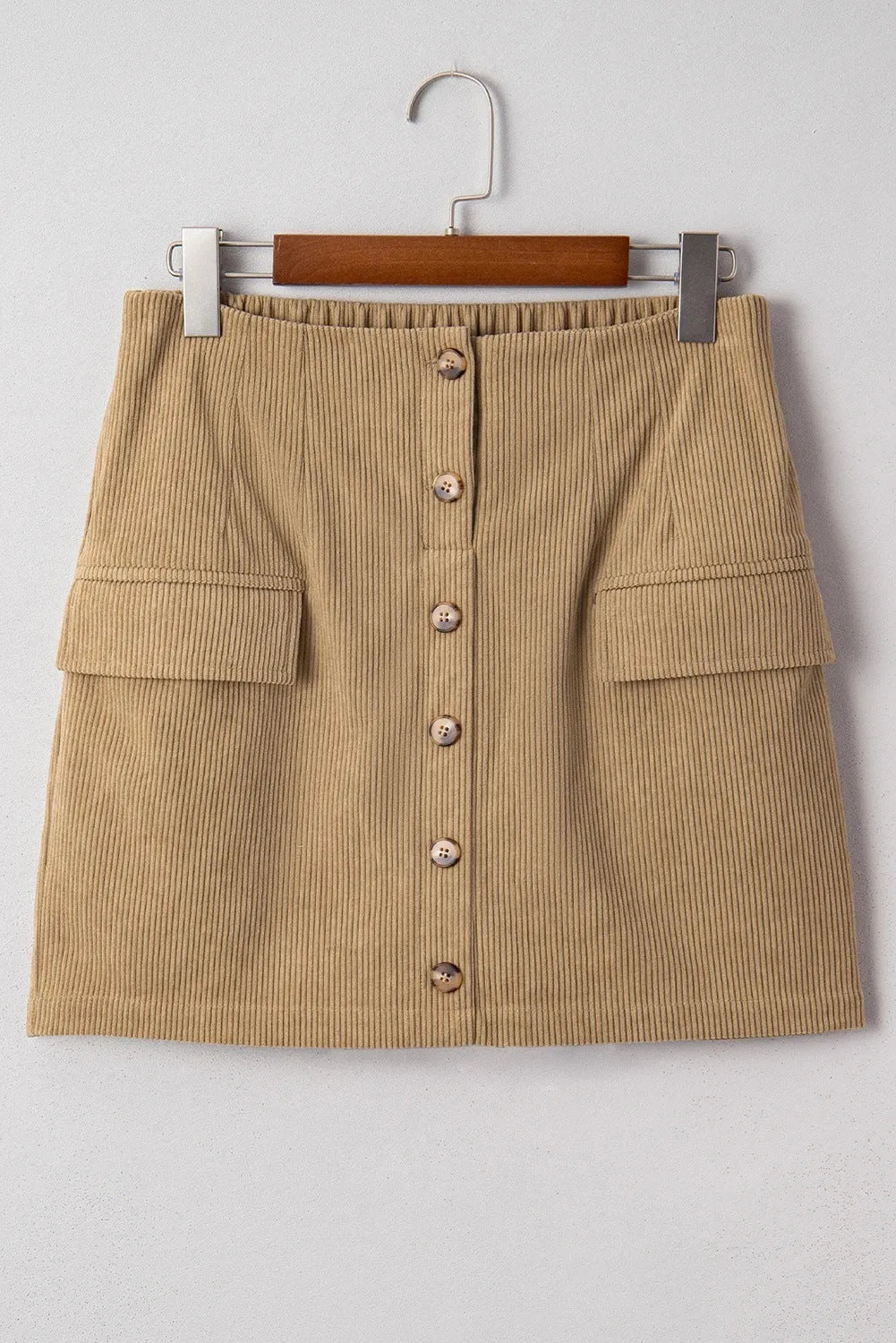 Women's corduroy hip skirt in solid coffee colour, short street-style design with button detail, sizes S to XL