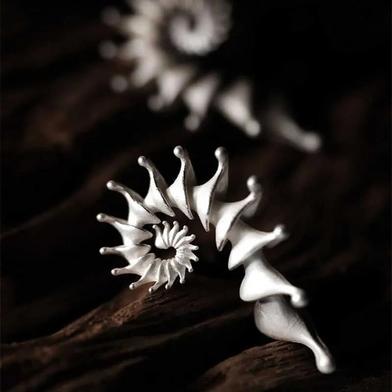 Conch-shaped three-dimensional matte earrings with exaggerated drop design and irregular shaping