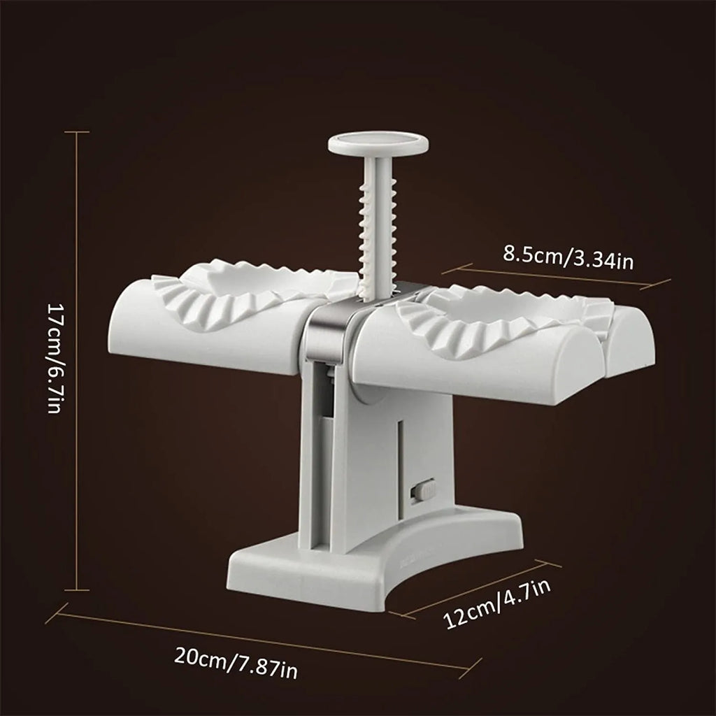 White double-head manual dumpling maker with anti-slip rubber base on a kitchen counter.