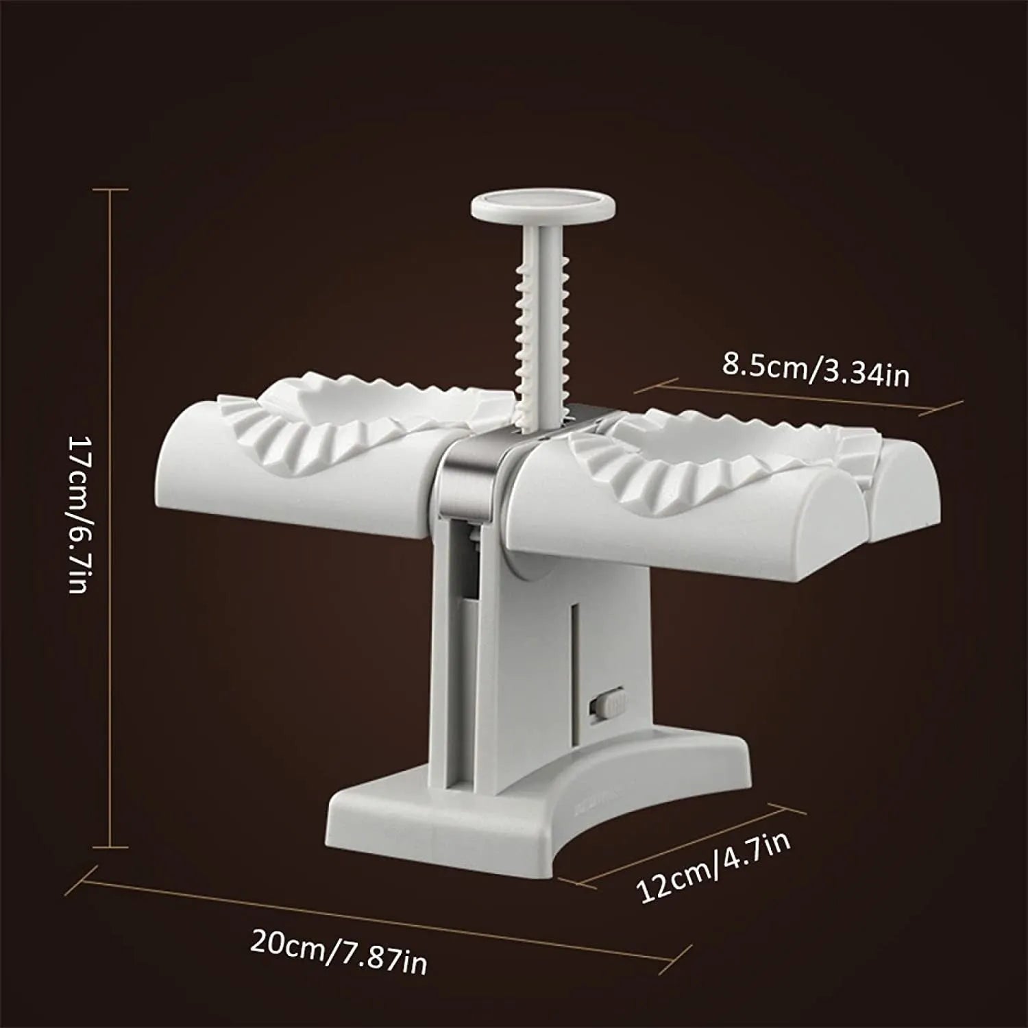 White double-head manual dumpling maker with anti-slip rubber base on a kitchen counter.