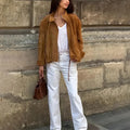Retro solid colour loose-fit long sleeve jacket on a hanger.