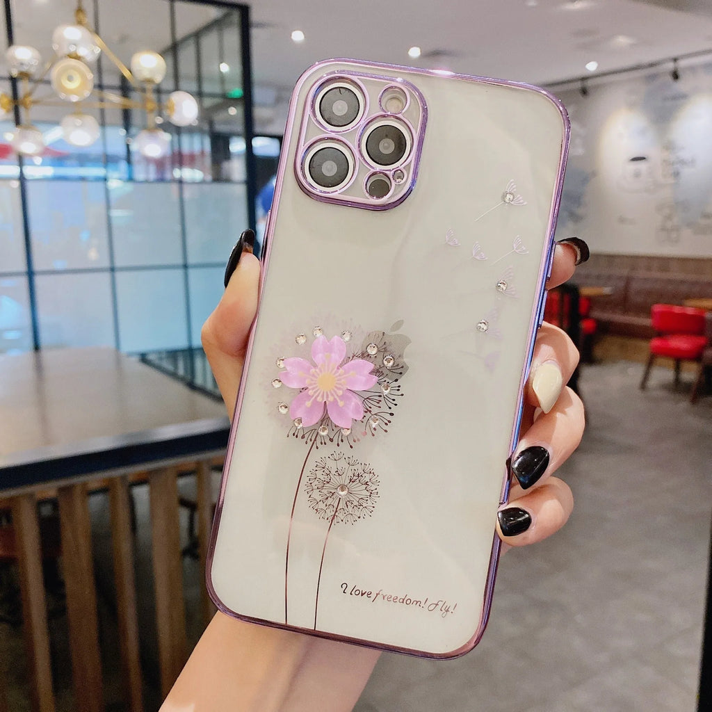 Green iPhone case with 3D white floral design and a silver rotating kickstand extended from the back.