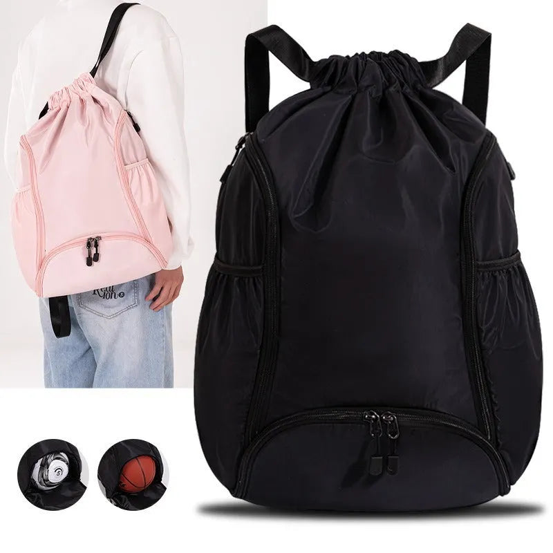 Large black cube-shaped sports backpack with a drawstring top closure, shown on a neutral background.