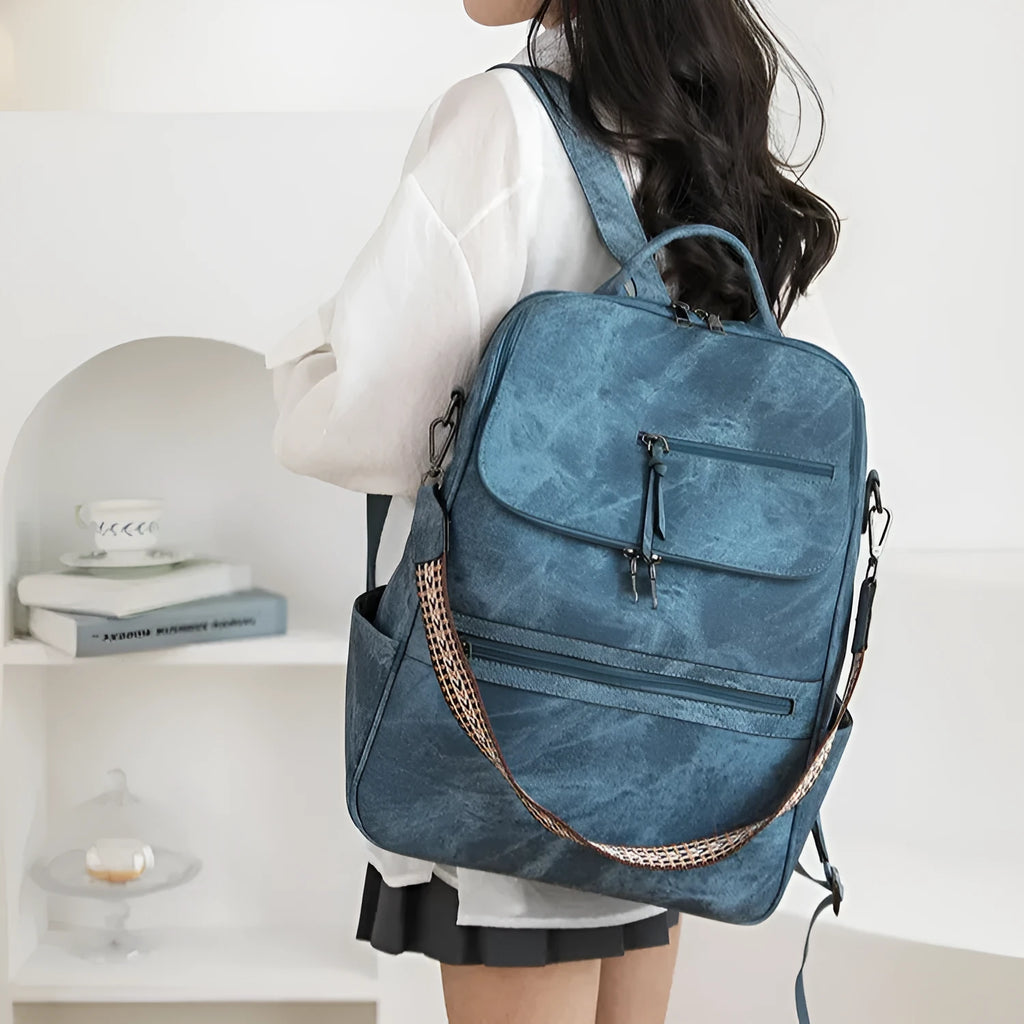 Retro college style PU backpack with curved shoulder straps, shown in one of six available colours.