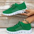Women's casual flying knit mesh sports flat shoes in a light colour with front lace-up design.