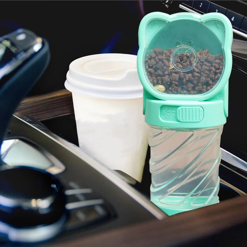 Green 3-in-1 portable pet water bottle with food container, waste bag dispenser, and carrying strap.
