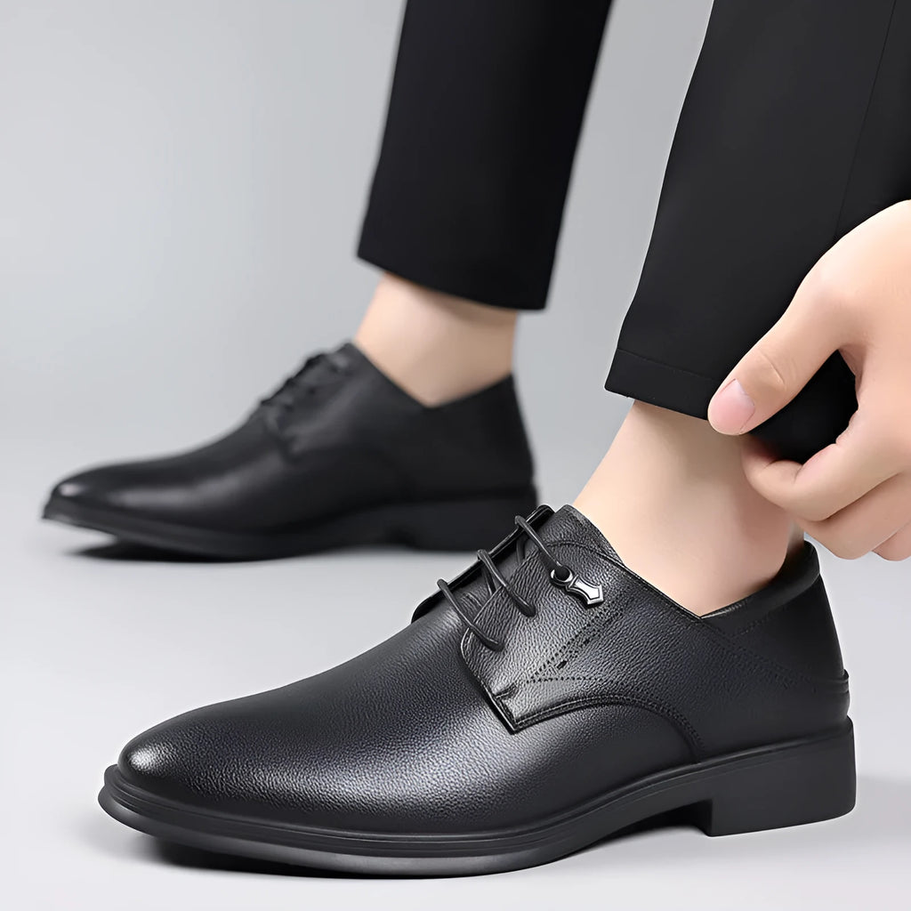 Men's black cow split leather pointed toe dress shoes with rubber sole on a white background