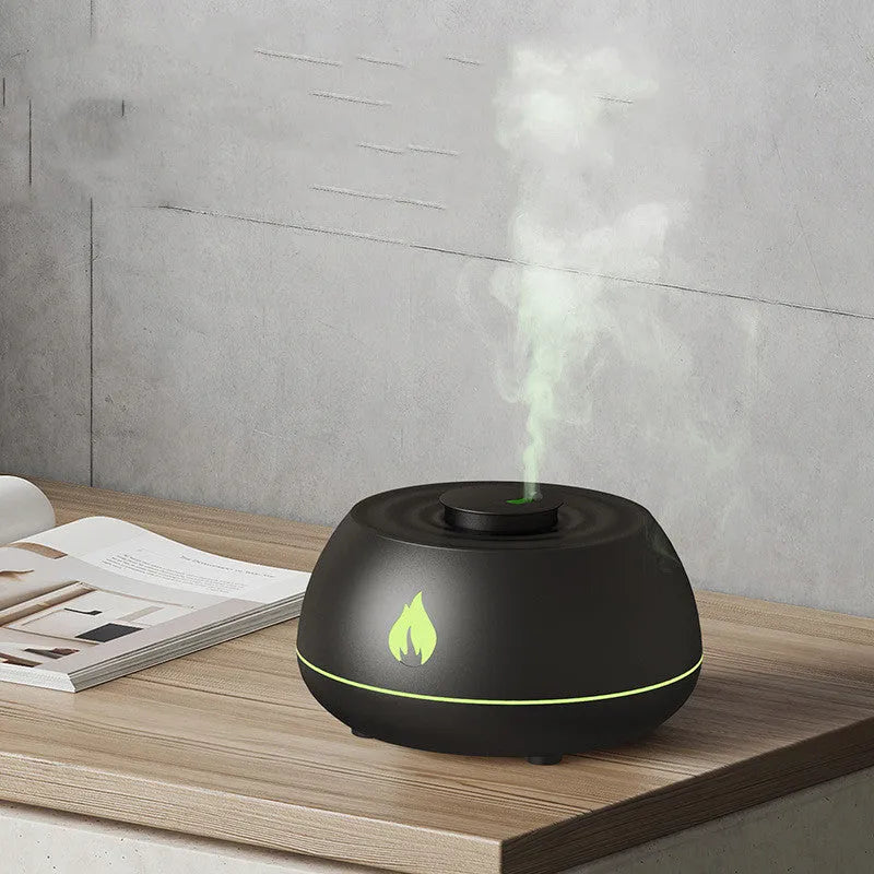Black flame effect humidifier diffuser with LED lights on a wooden surface