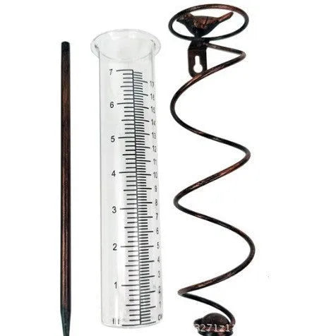 Cast iron hummingbird garden rain gauge with glass measurement tube showing 1-20 scale.