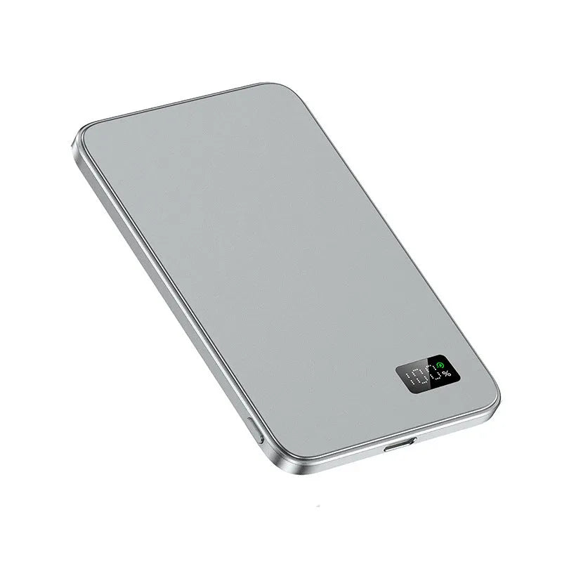 Simple thin wireless magnetic power bank F20 in black with alloy shell on a table