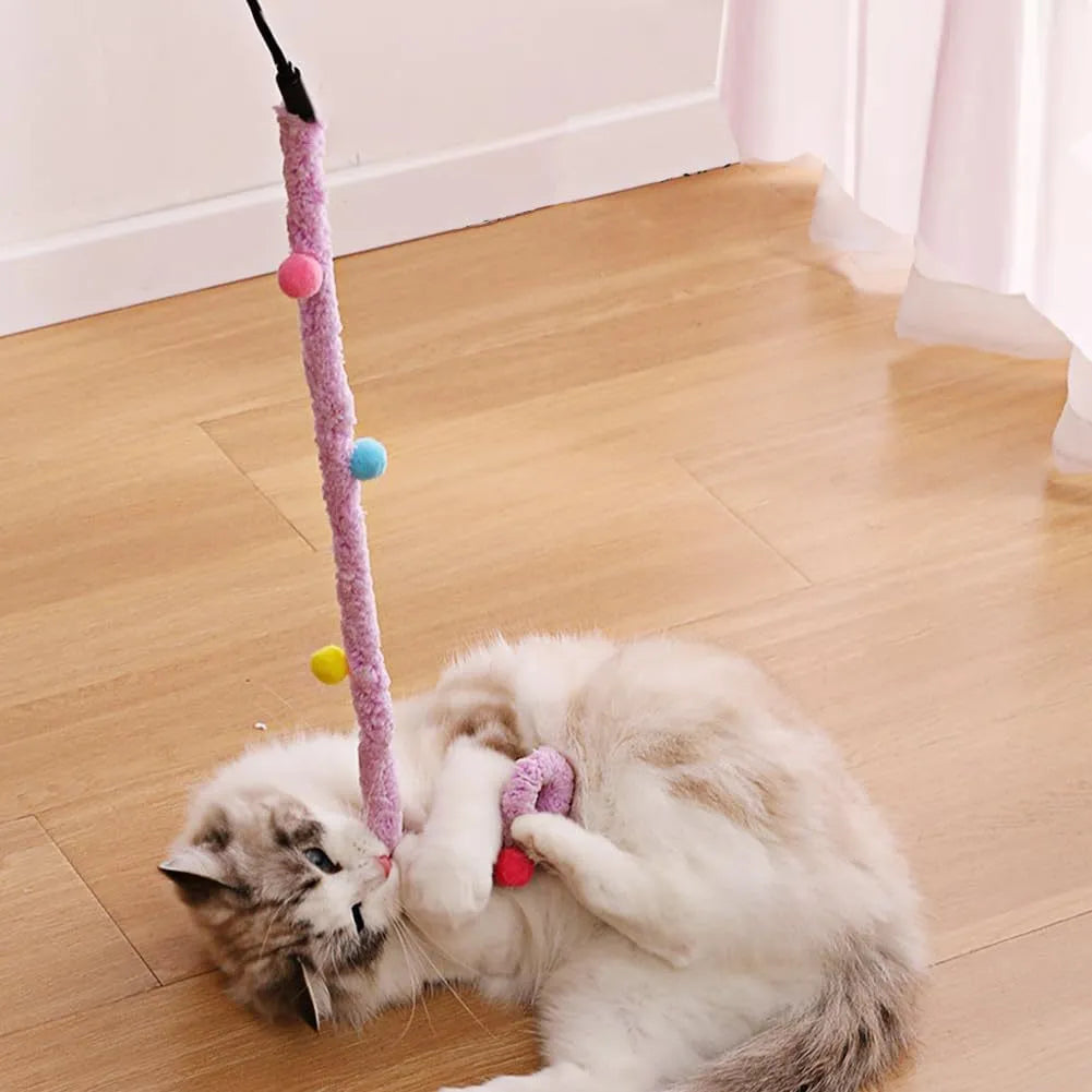 Cat wand toy with long plush strip and colourful ball featuring bells for interactive indoor play