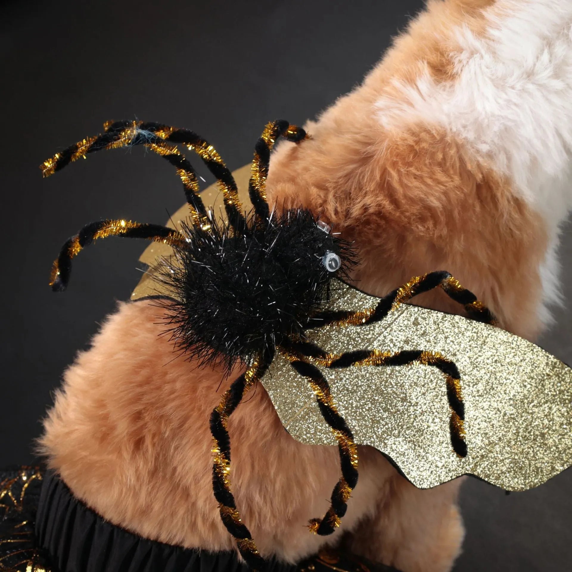 A dog wearing a black and white Halloween suit costume, shown in size L.
