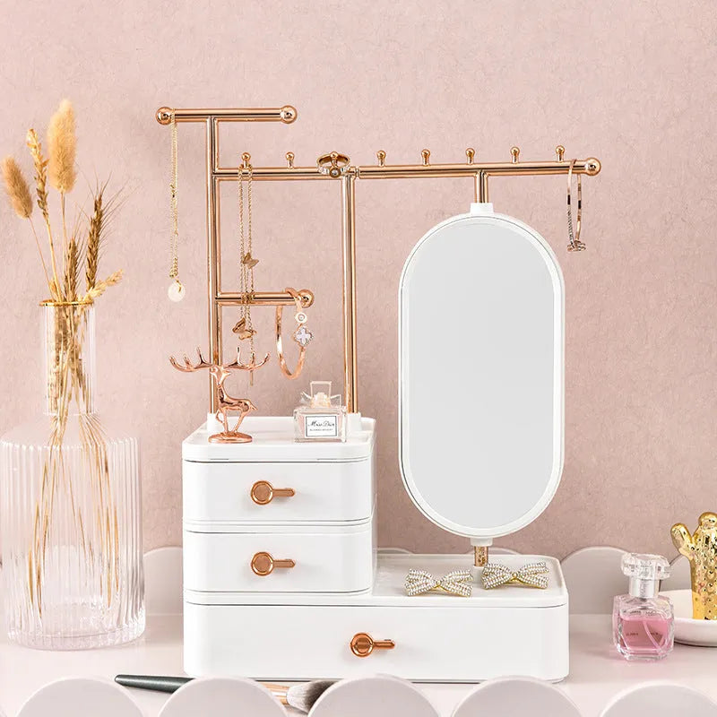 Cosmetics storage box with mirror in pearl white plastic, 27x17x18cm, on desktop with makeup items