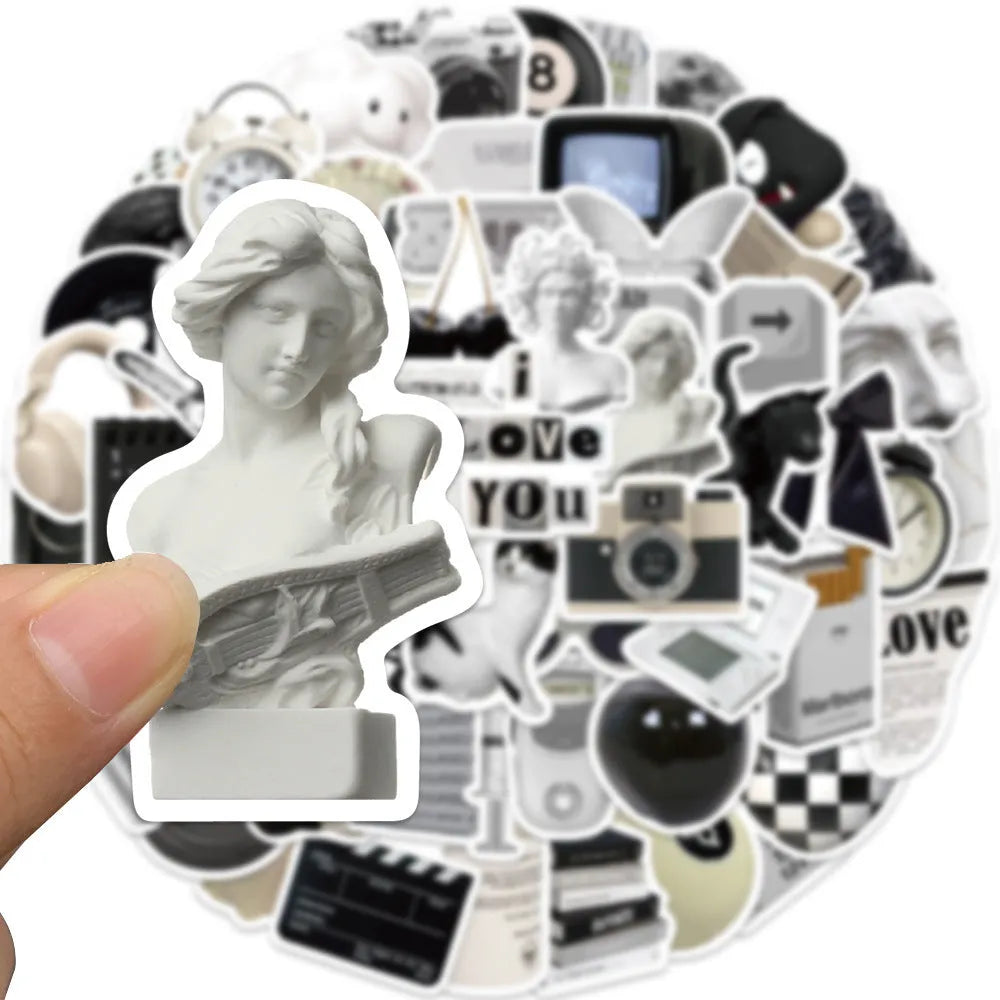 Set of 61 black and white waterproof PVC stickers for laptops, phones, luggage, and other personal items.